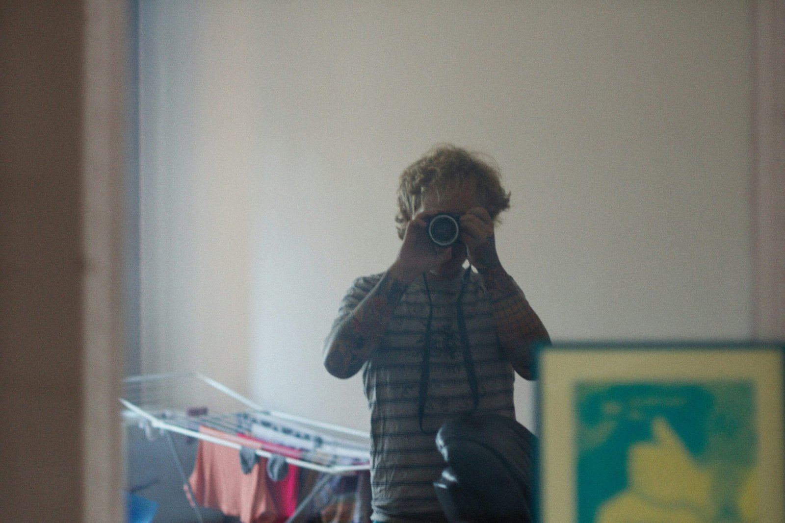 a man taking a picture of himself in a mirror