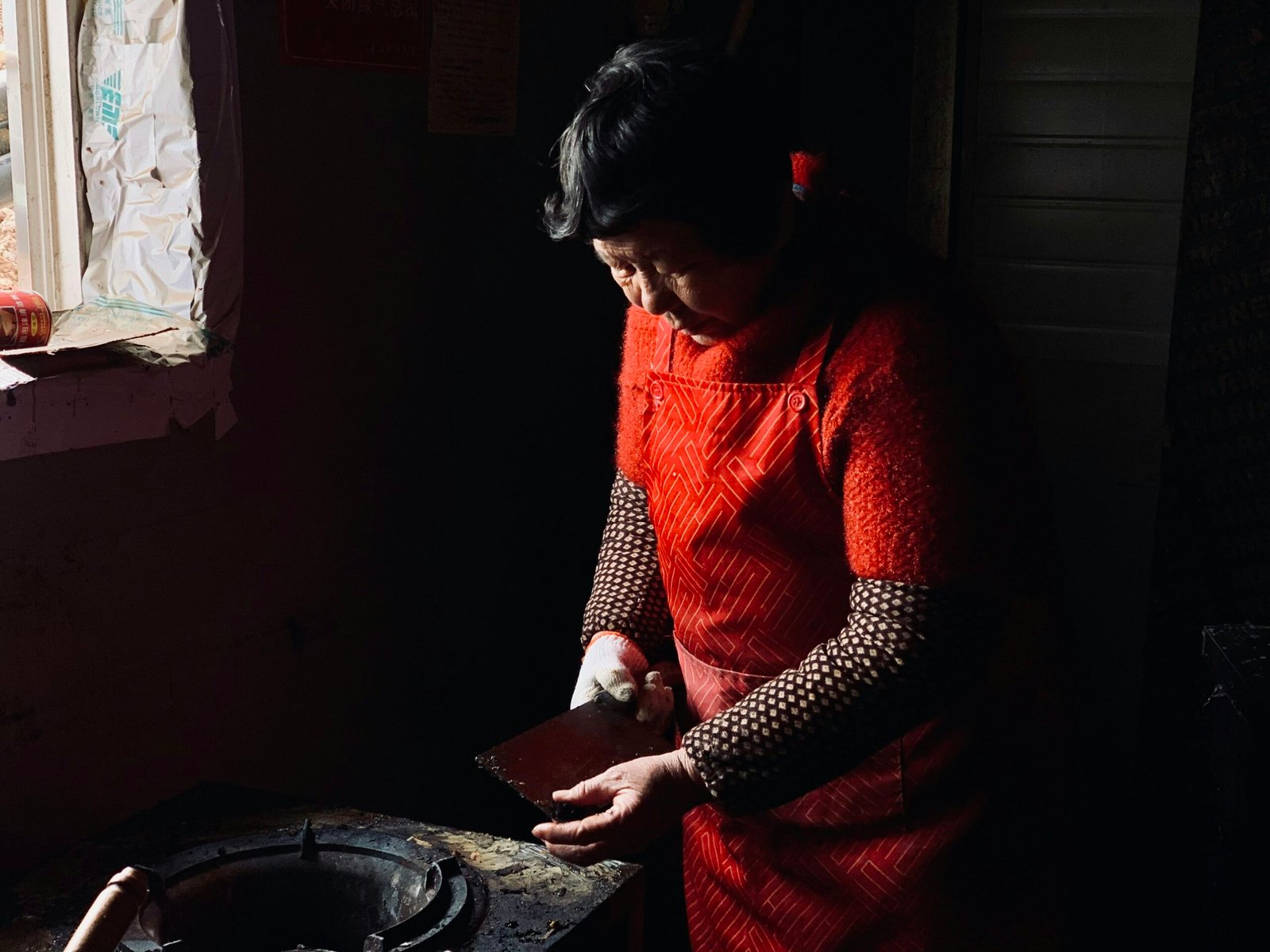 woman in red long sleeve shirt sitting on floor
