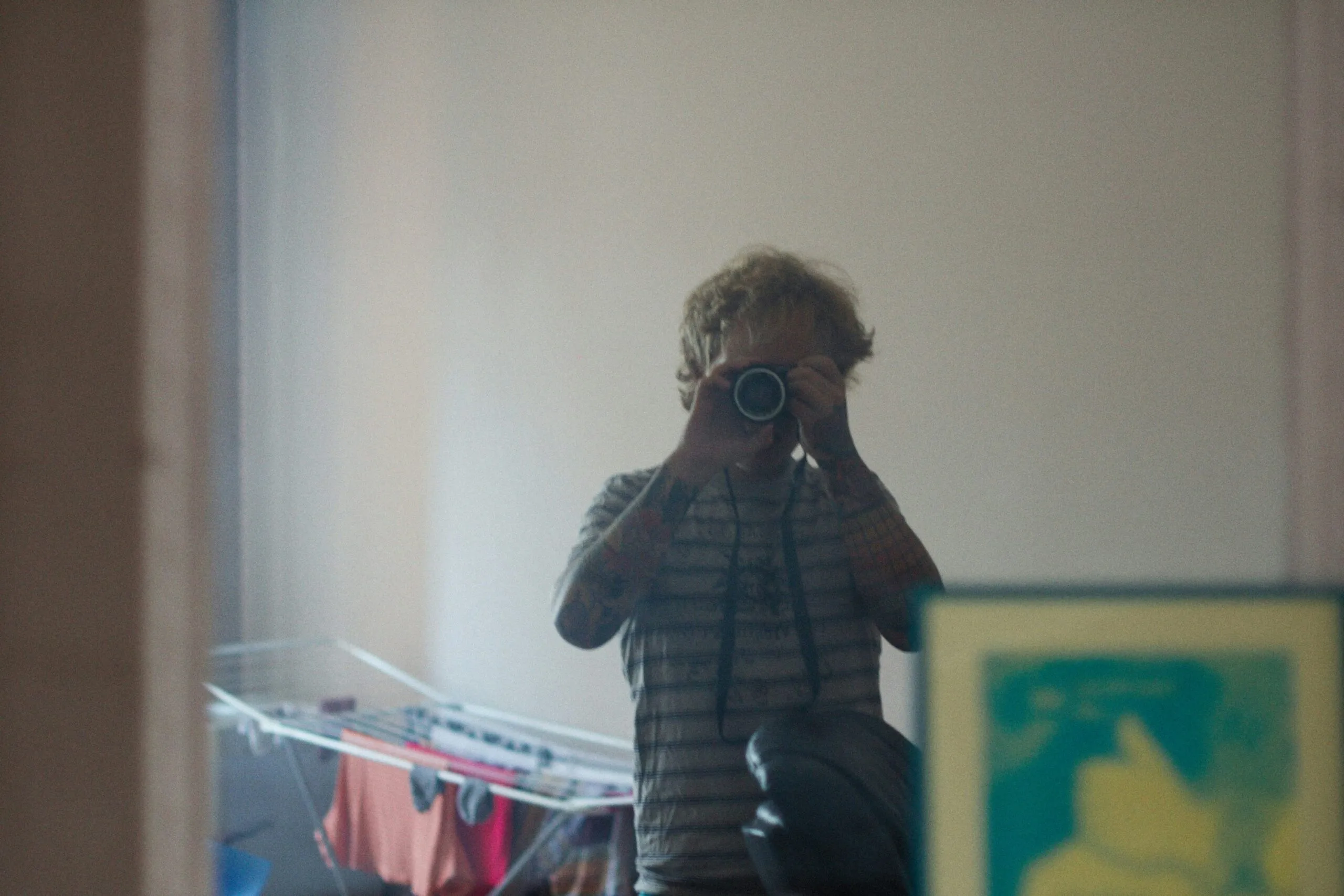 a man taking a picture of himself in a mirror