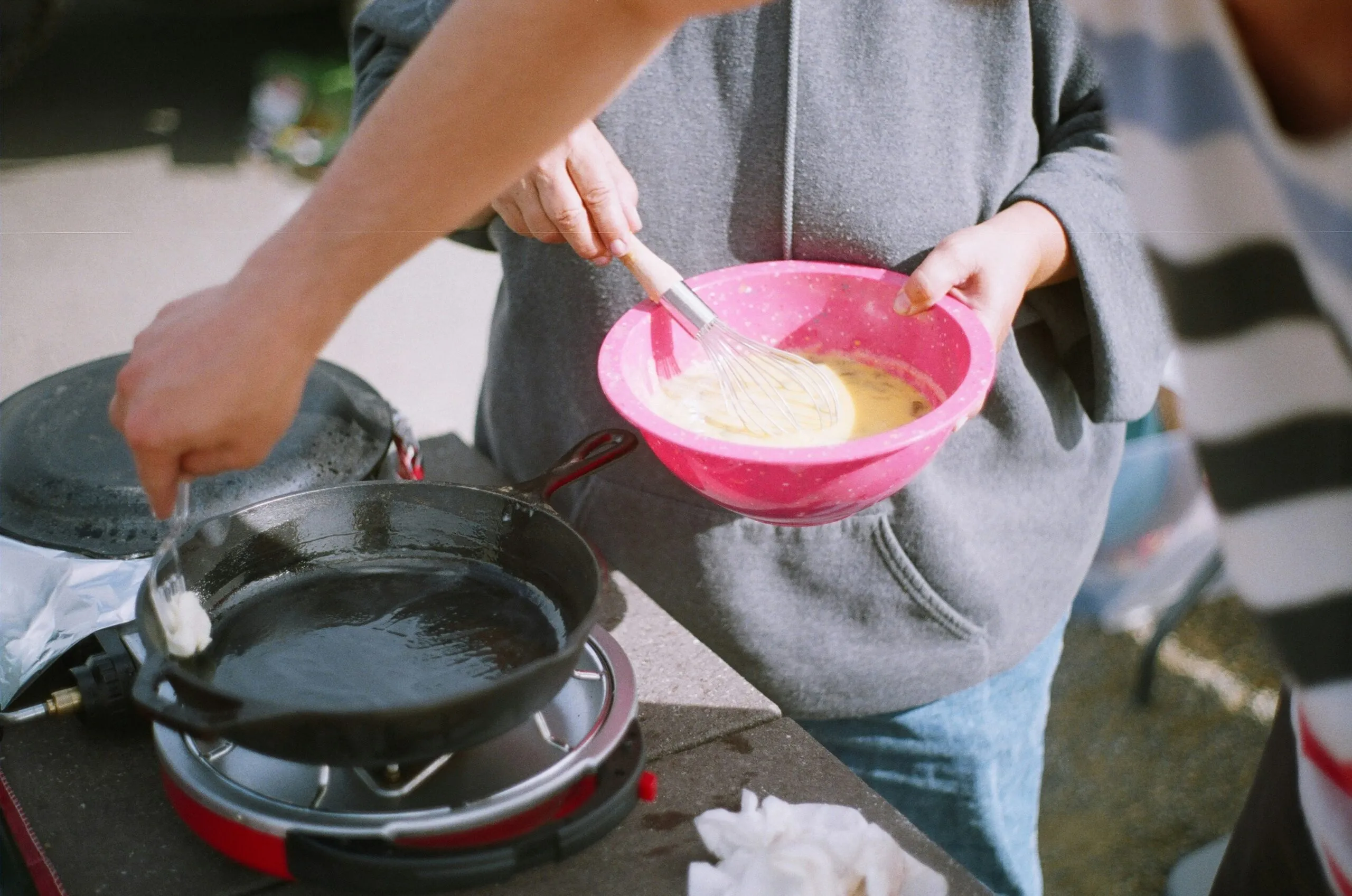 two people cooking