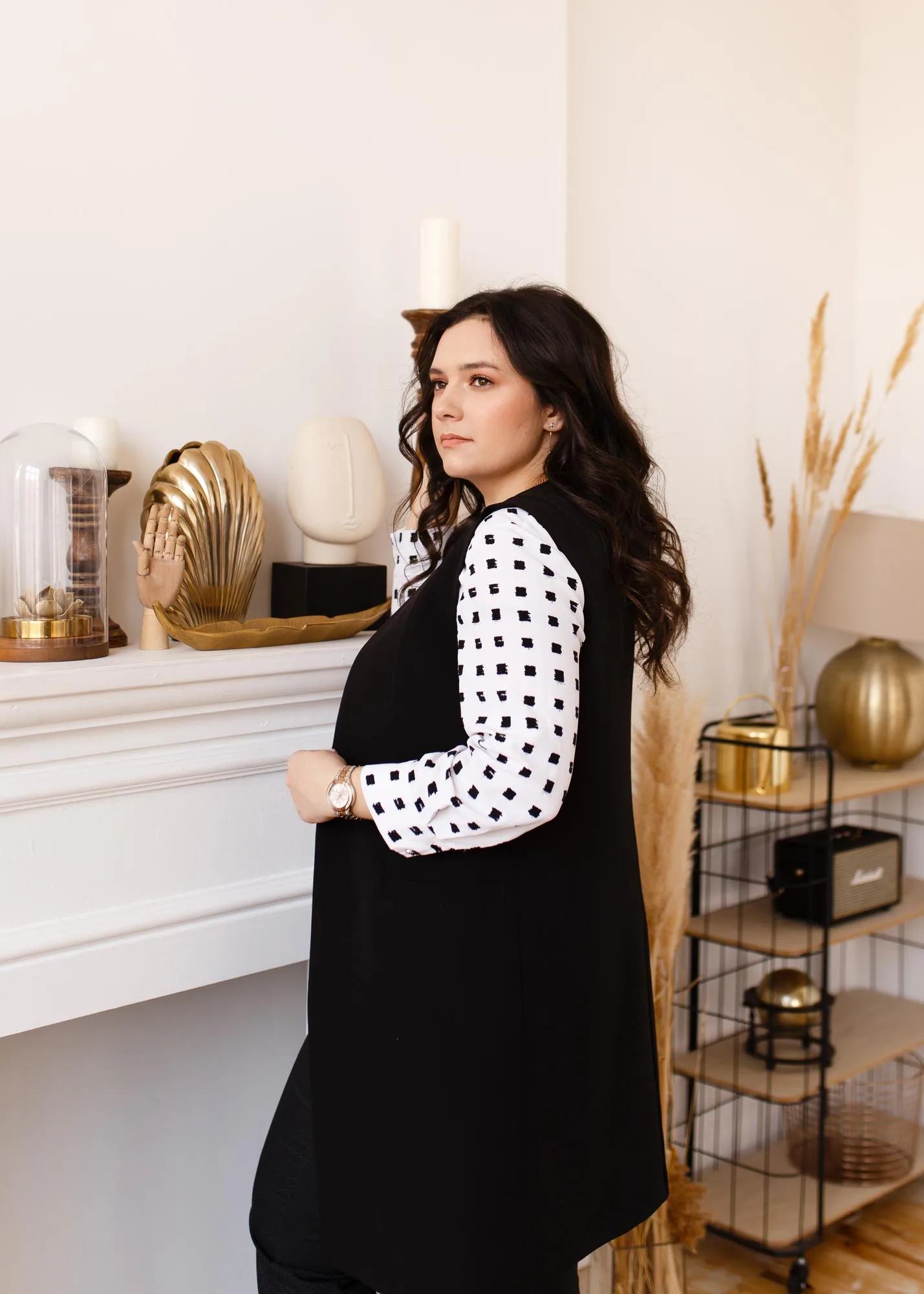 Beautiful young businesswoman standing at home