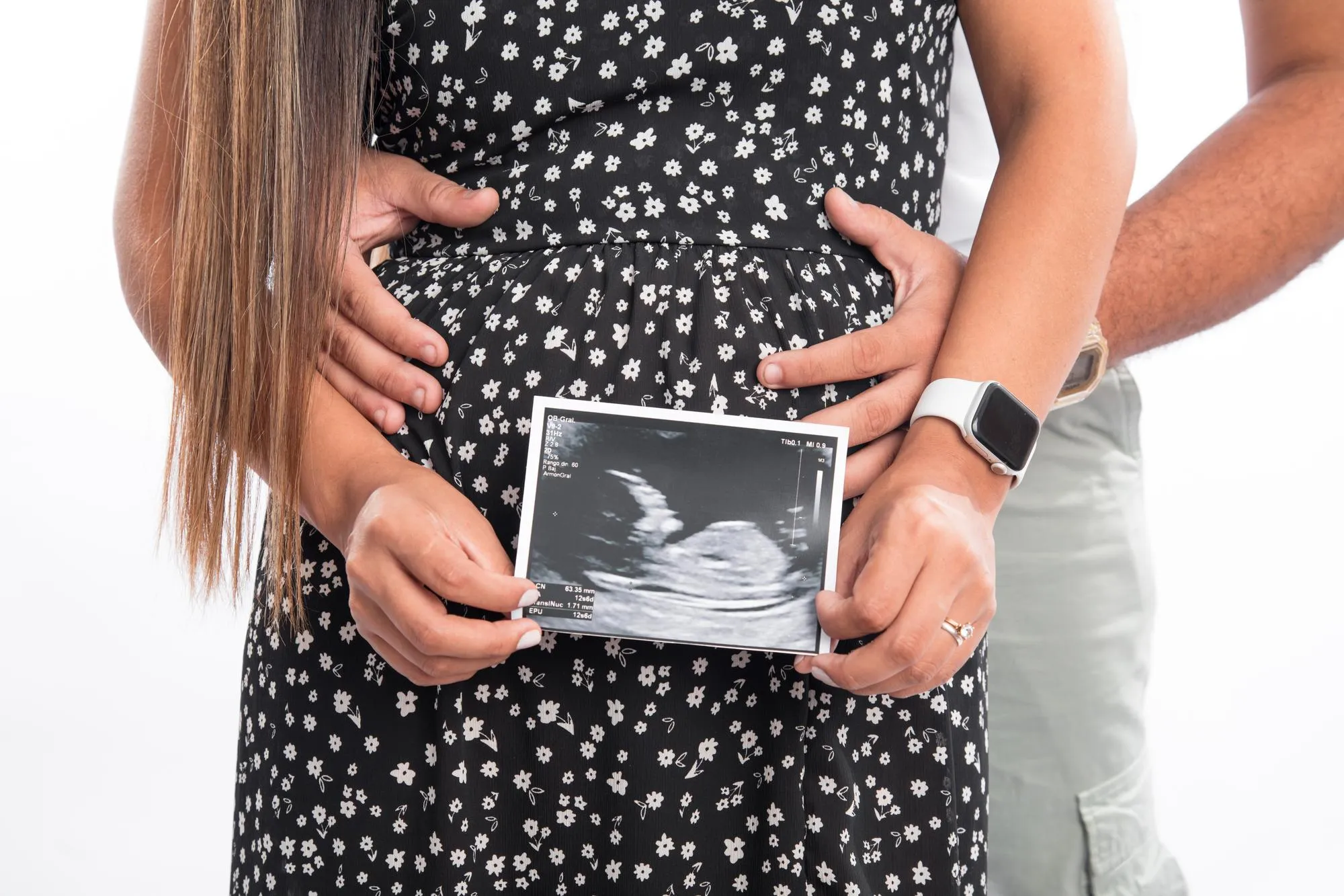 Big Pregnant belly with echography showing baby picture motherhood