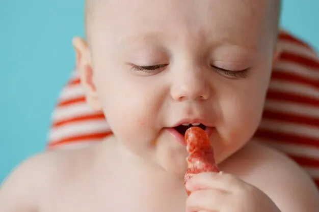 A child eats sausage