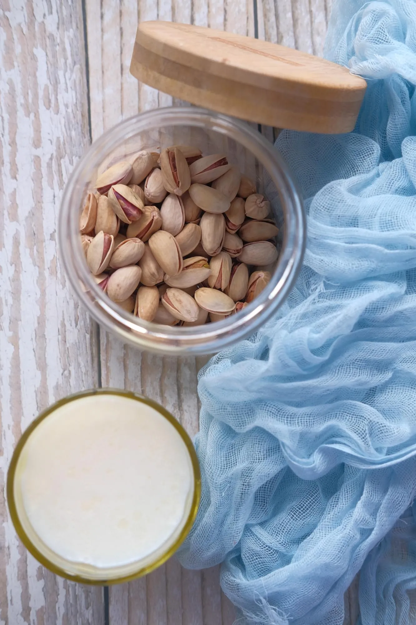 Dairy products nut and glass of milk on wooden table