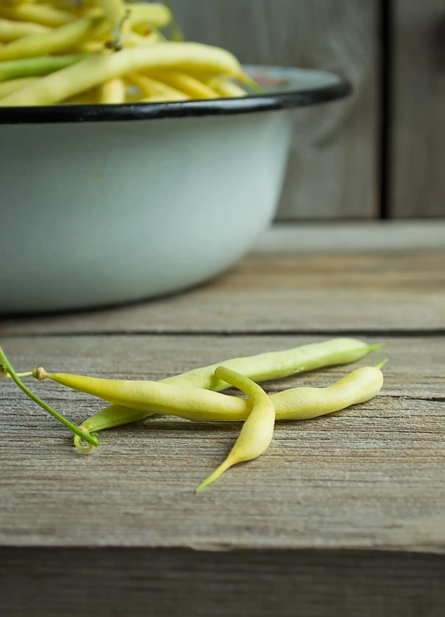 Fresh organic yellow beans on a wooden background