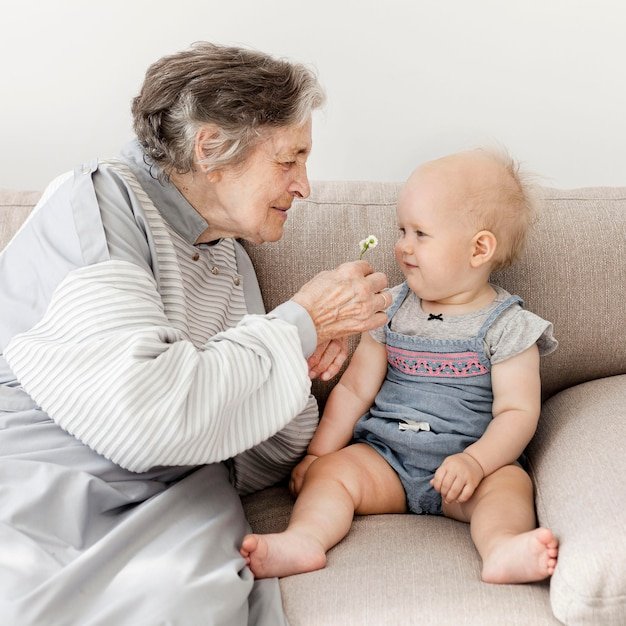 Grandmother happy to play with baby