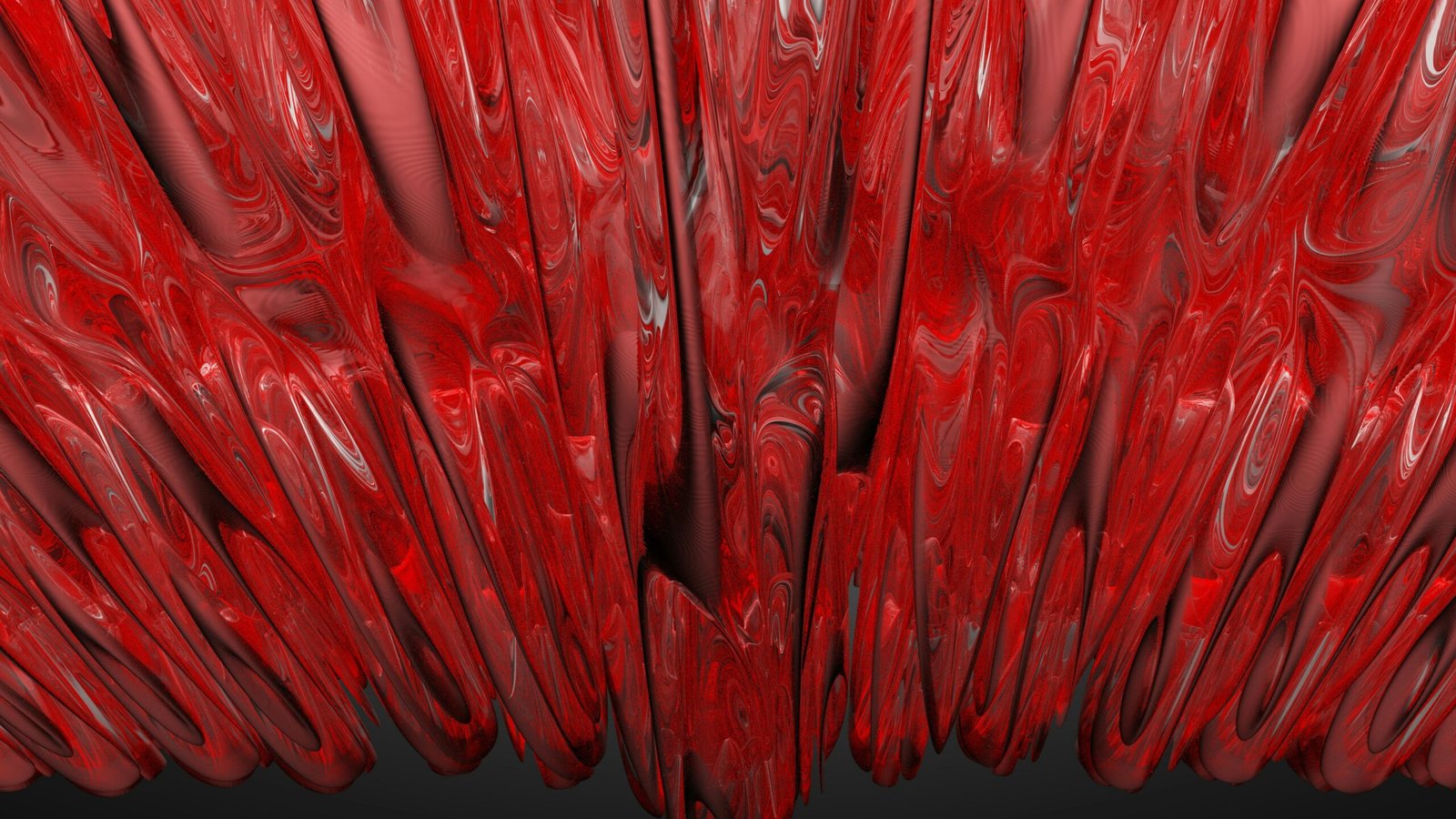 a close up of a red object with a black background