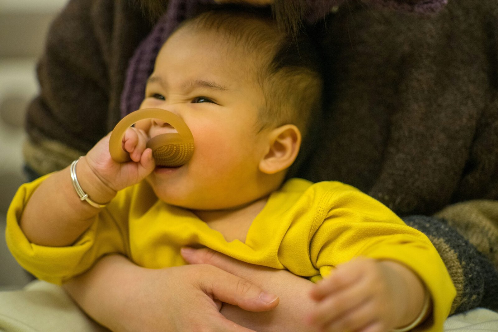 a baby with a pacifier in its mouth