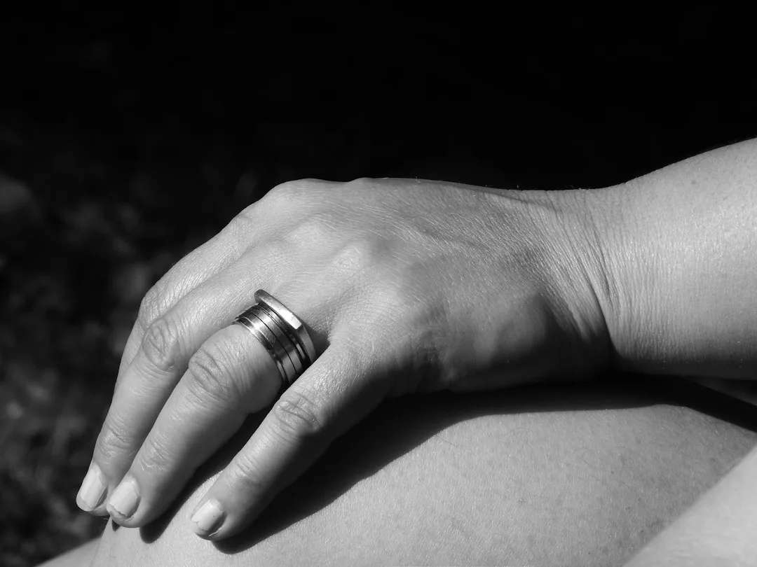 person in silver ring