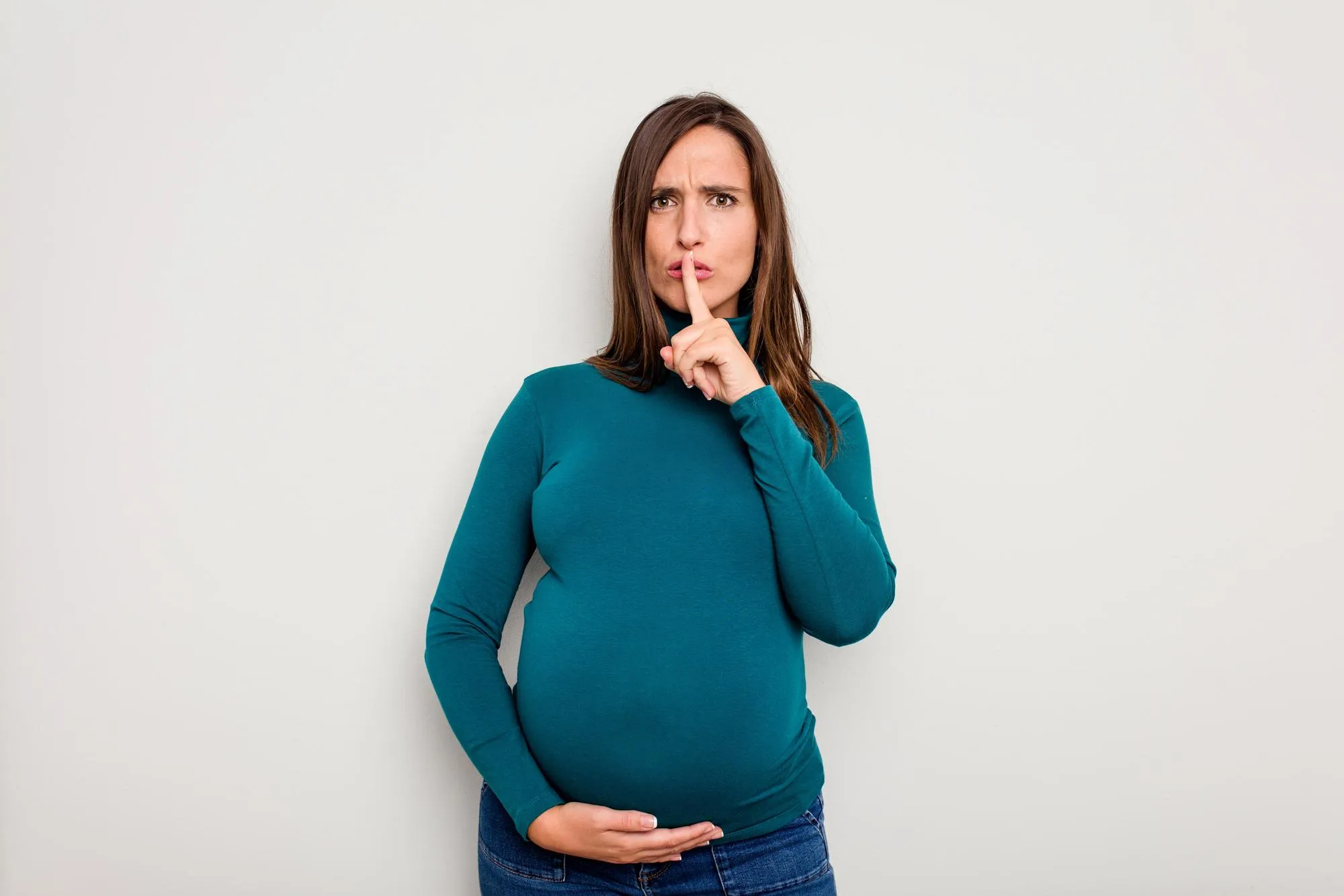 Keeping a secret or asking for silence