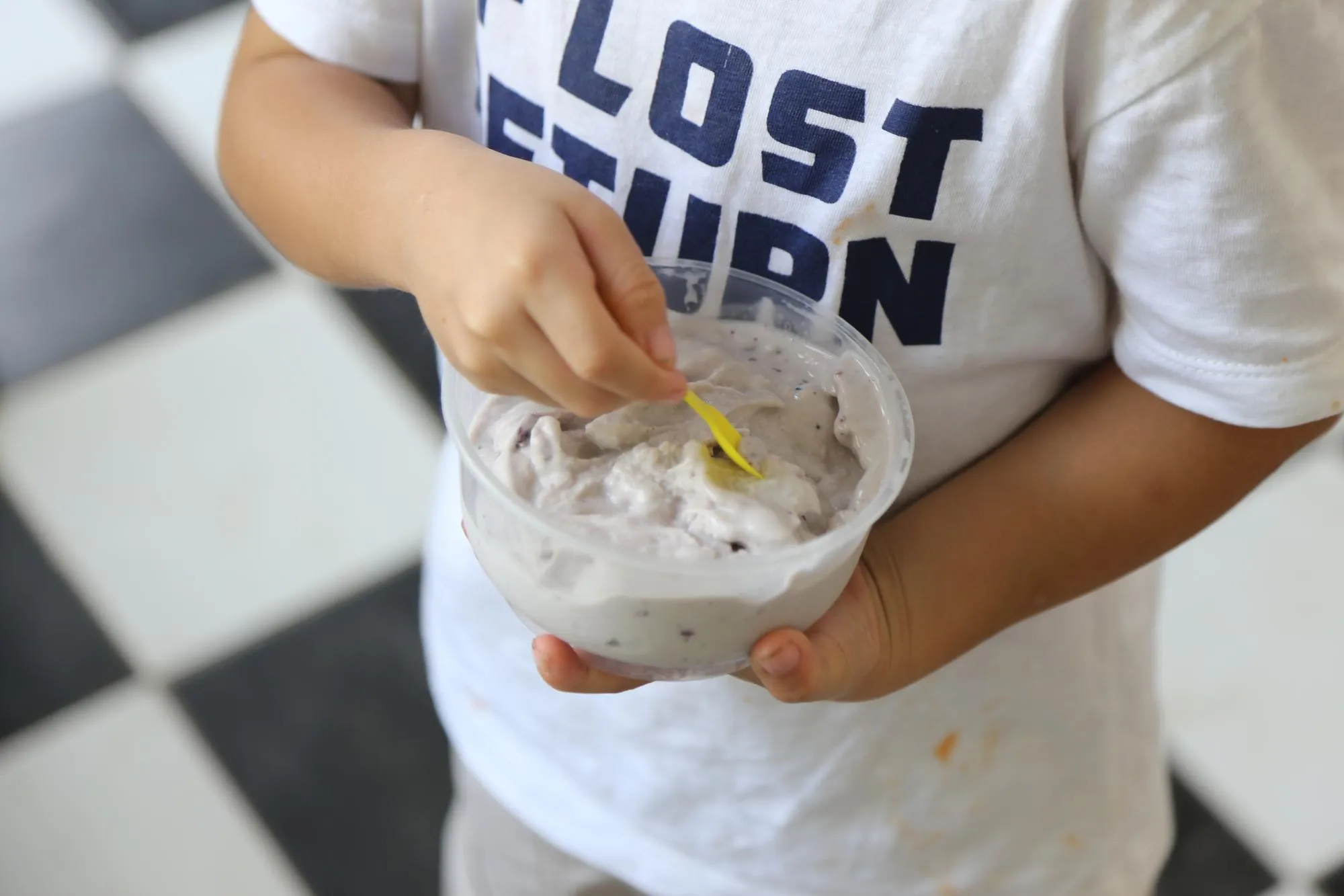 Midsection of man holding ice cream in bowl
