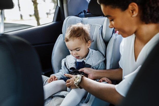 Mother and daughter sitting in car