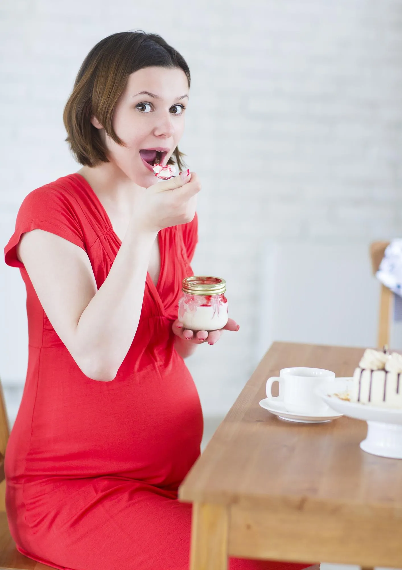 Portrait of woman with coffee cup on table