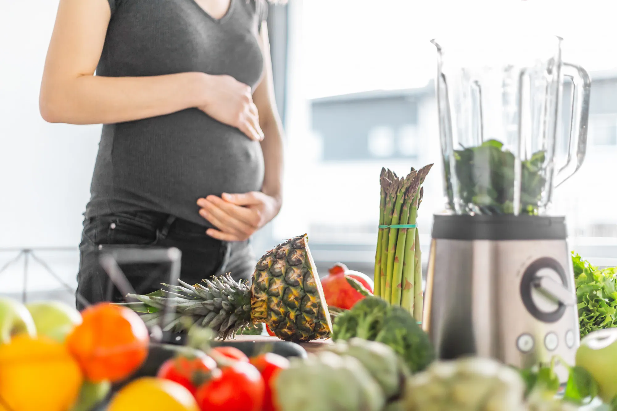 Pregnant woman cooking healthy food