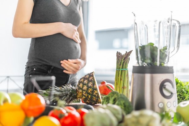Pregnant woman cooking healthy food