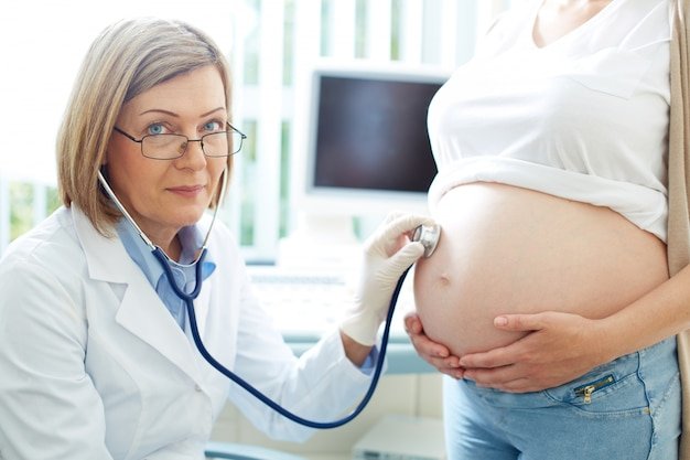 Pregnant woman visiting doctor