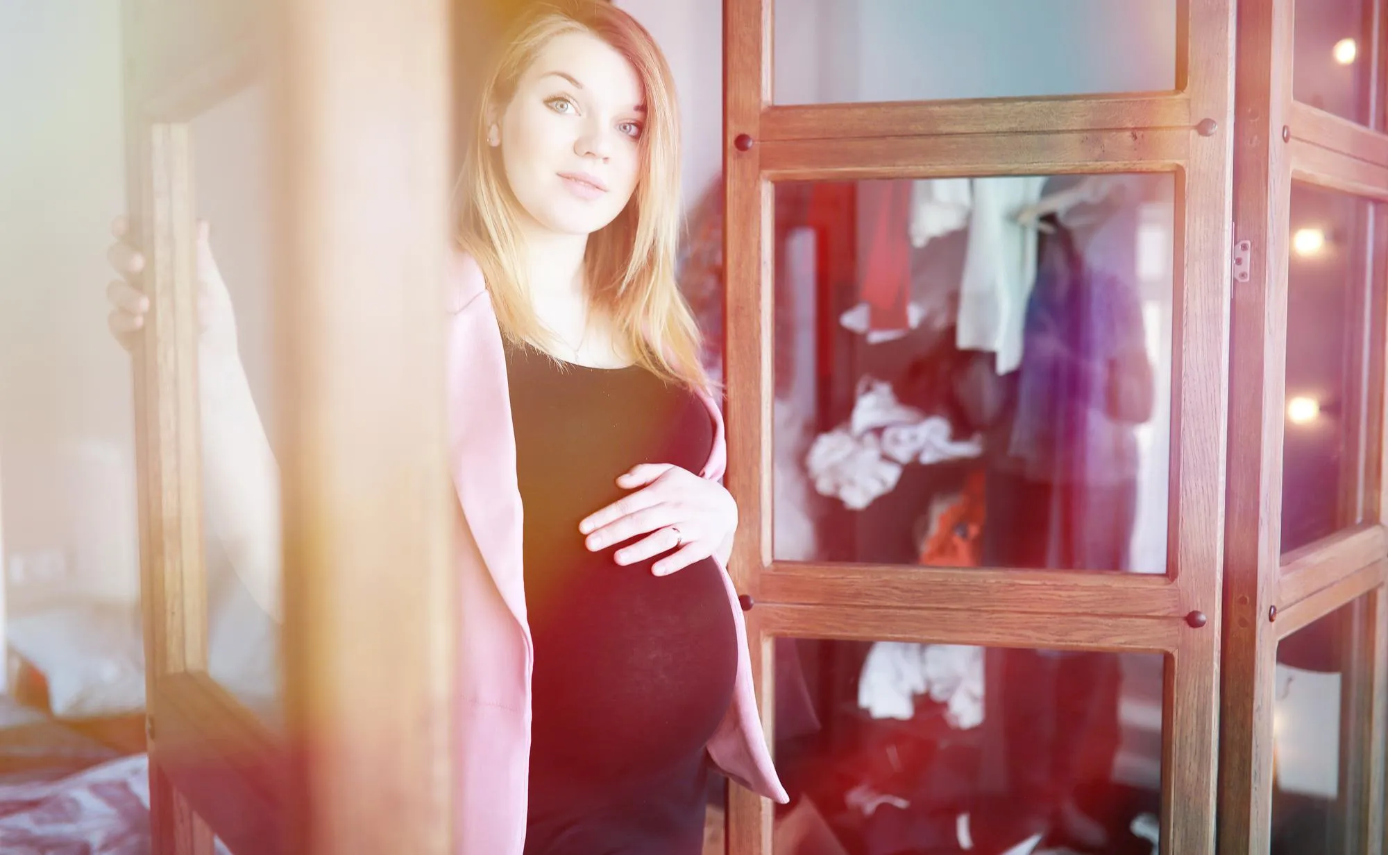 Pregnant young beautiful girl on the ninth month indoor