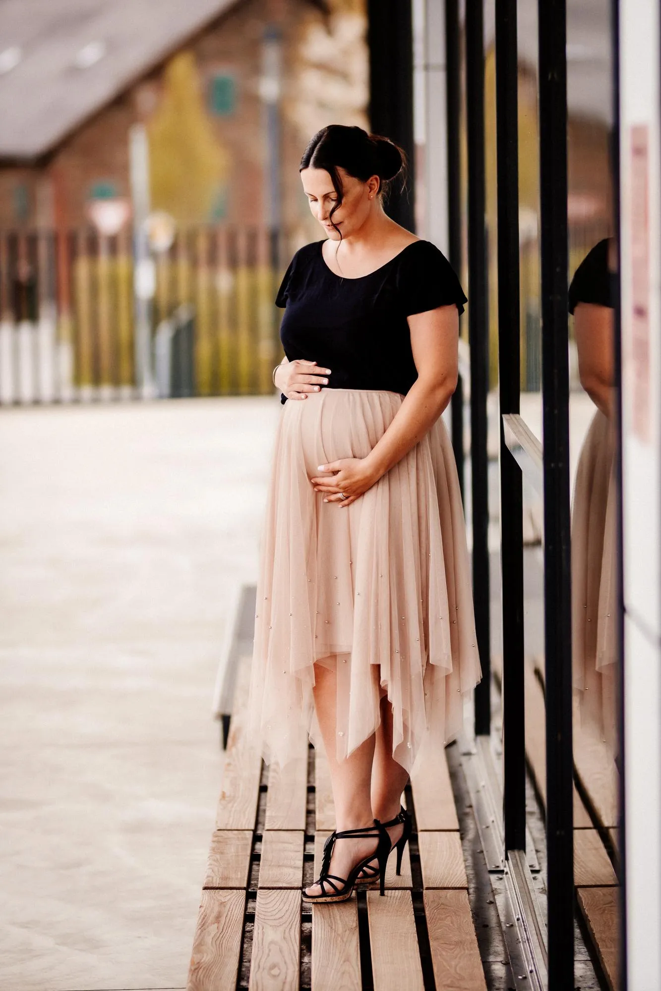Vertical shot of a pregnant female posing outdoors in Germany