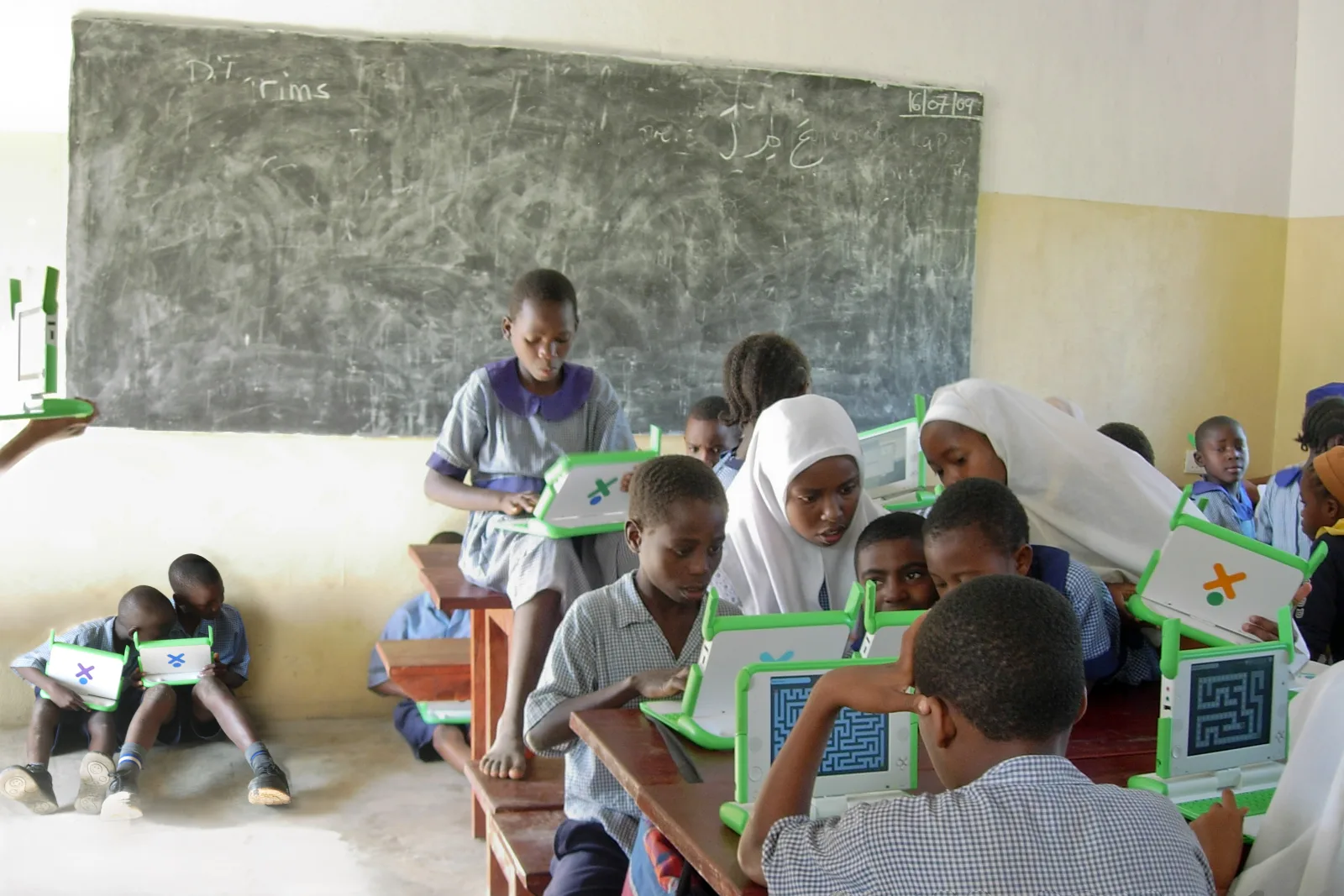 Exploring activities in class. Takaungu, Kenya. A group of students explores activities in a Takaungu school, from Mazes to recording sound and video to simple programming activities.