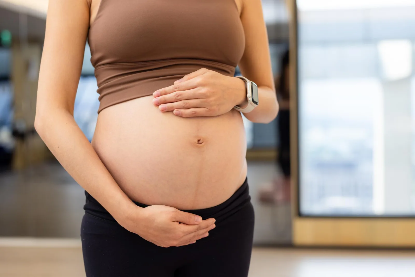 Pregnant woman in the yoga studio