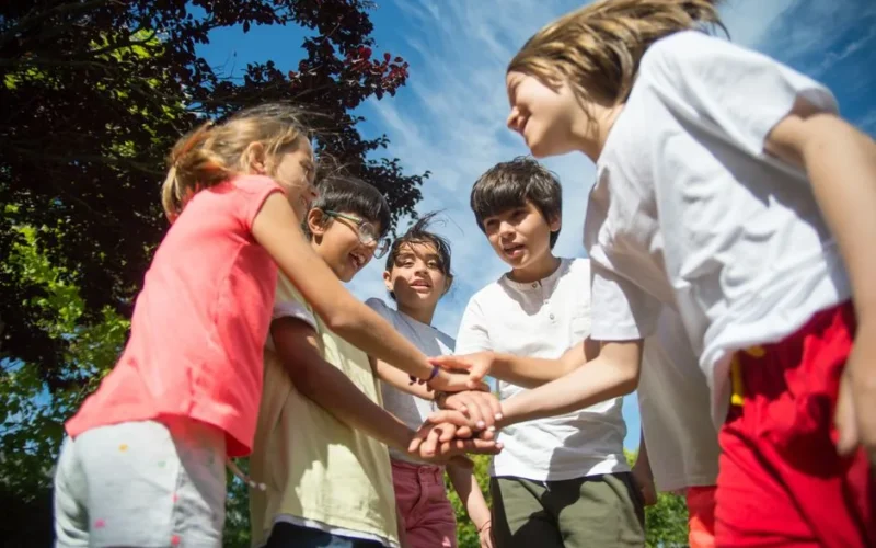 A group of kids enjoying a sunny day outdoors, capturing the joy and friendship of childhood.