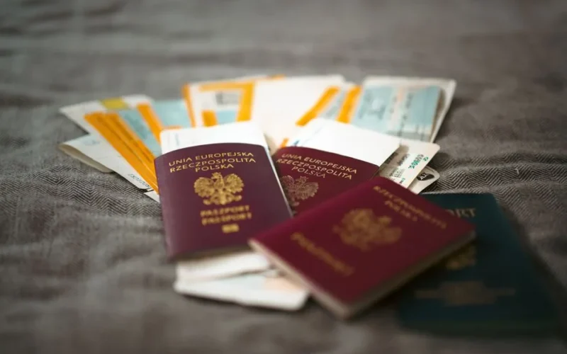 Close-up of Polish passports and travel tickets symbolizing travel and adventure.