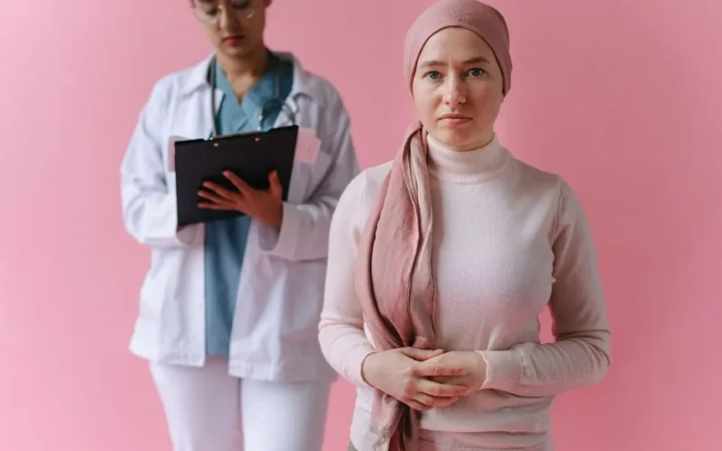 A hopeful cancer patient with a doctor in support during treatment process.